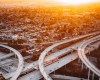 [Image description: An aerial shot of busy highways.] Via Unsplash